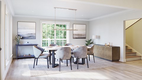 A dining room with a table set for four.