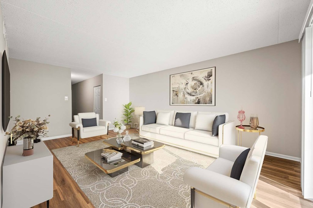 A living room with a white sofa, a coffee table, and a painting on the wall.