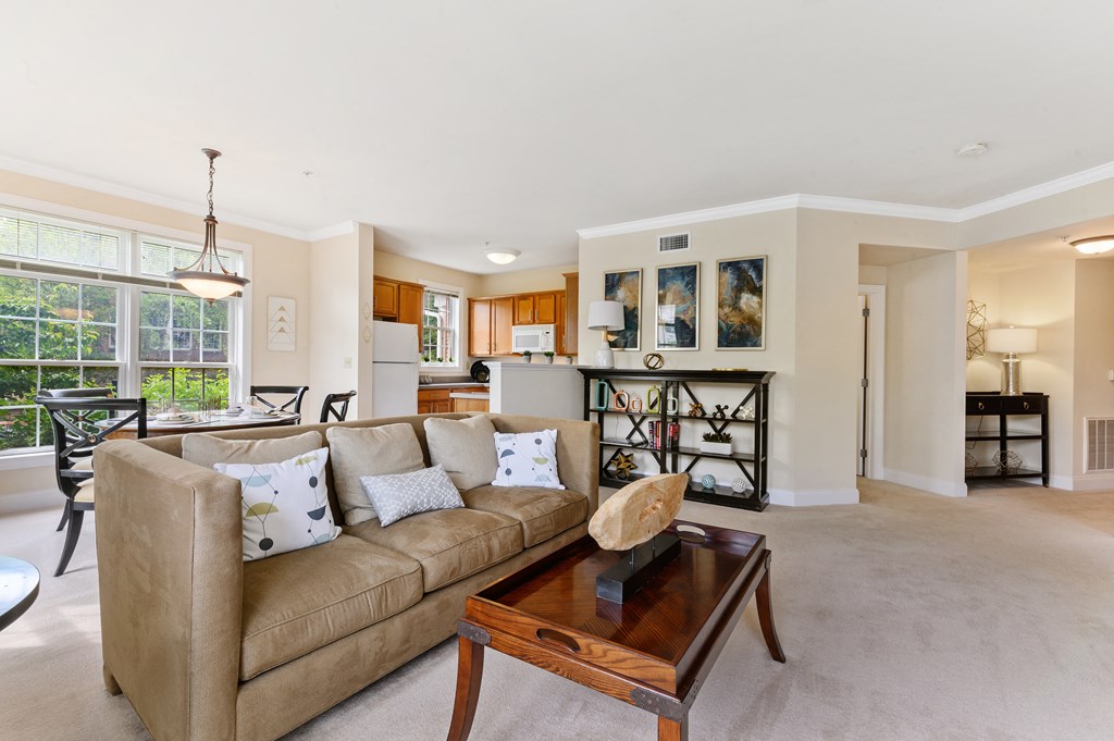 Spacious living area with modern touches, offering a comfortable space for relaxation at Claremont Apartments in Exton, PA