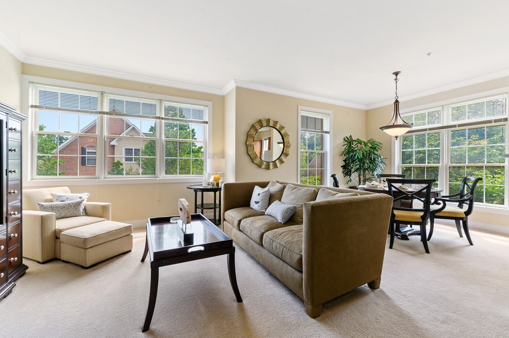 Bright, sunlit living area with plenty of natural light, creating a warm and inviting atmosphere at Claremont Apartments in Exton, PA