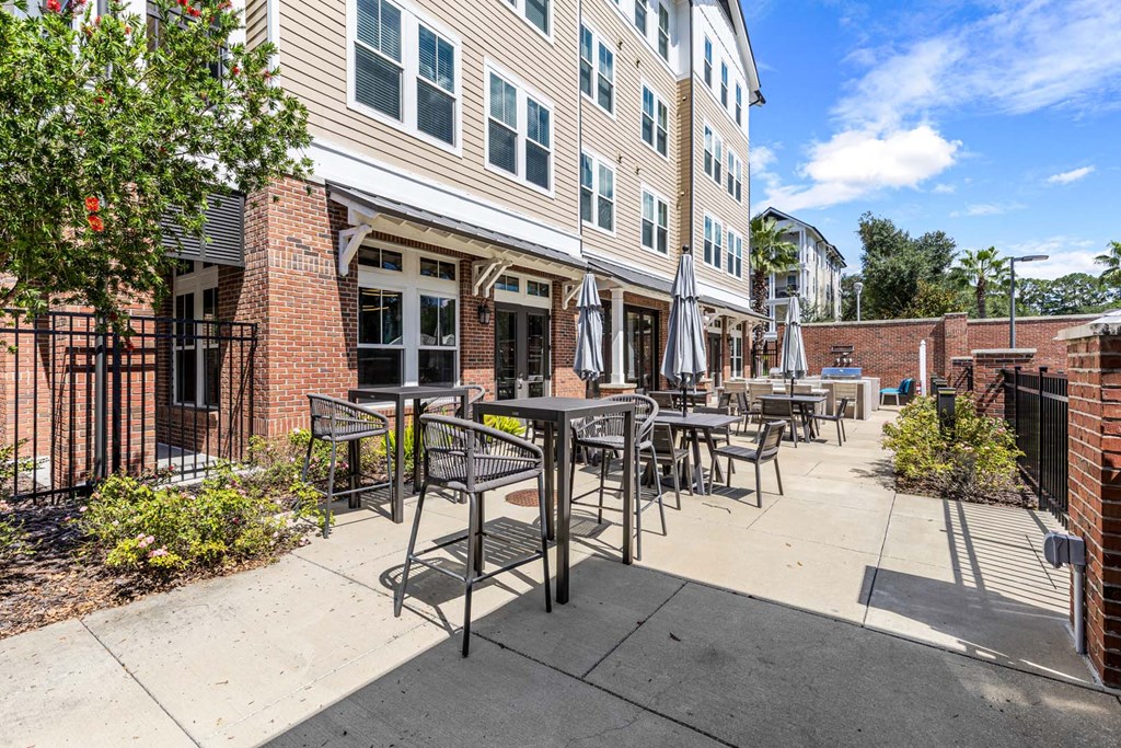 A patio area with tables and chairs is shown.