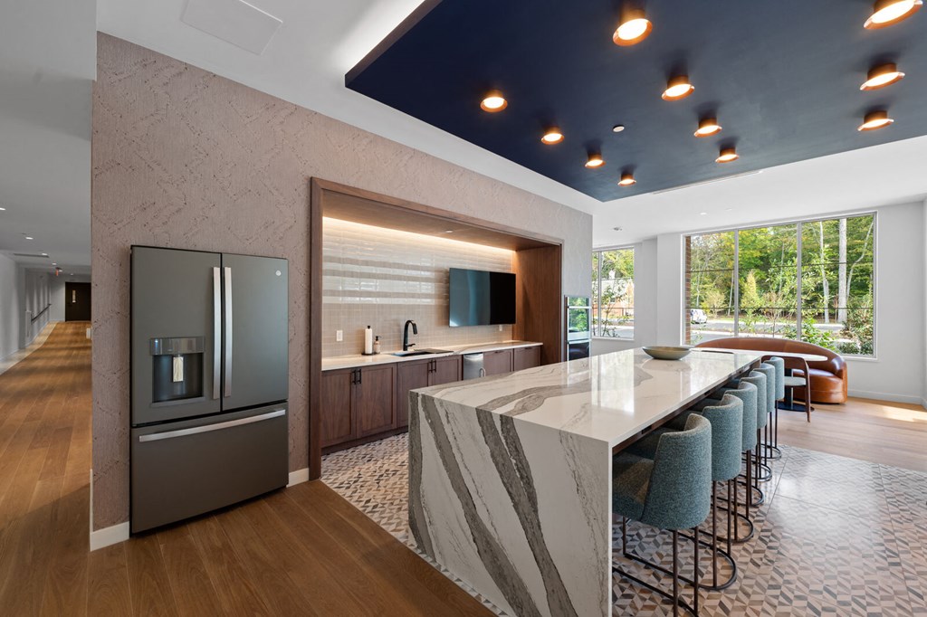 Entertainment-ready kitchen with a large island and double-door refrigerator at Hamilton at Eagleview, Exton, PA