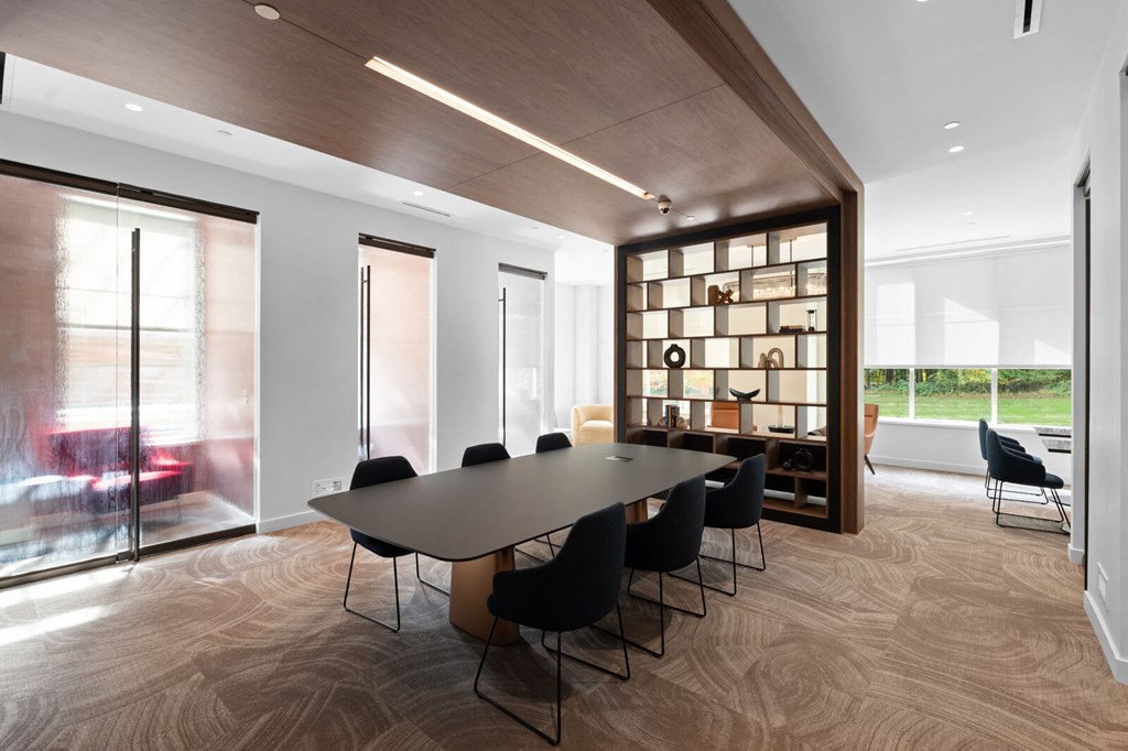 Co-working space featuring a conference table and an elaborate bookshelf at Hamilton at Eagleview, Exton, PA