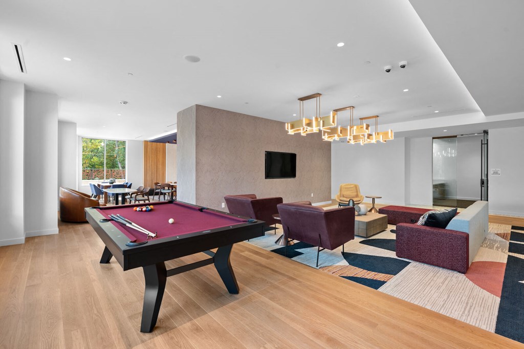 Spacious living room featuring a pool table and comfortable couches at Hamilton at Eagleview, Exton, PA 19341
