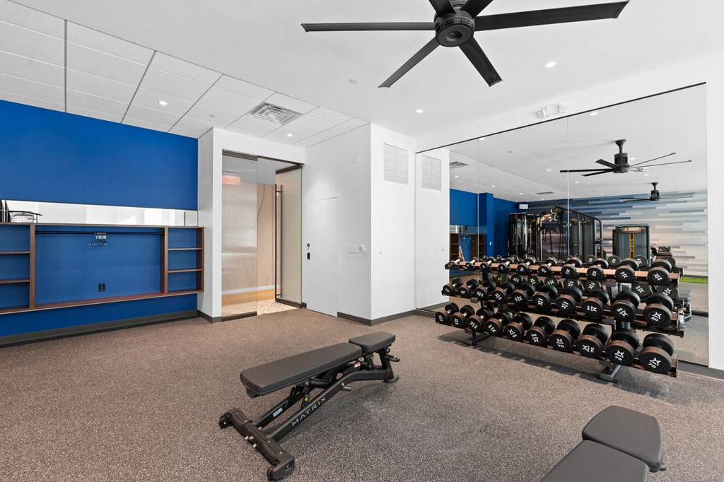 Well-equipped fitness area featuring free weights and a large fan for added comfort at Hamilton at Eagleview, Exton, PA 19341.