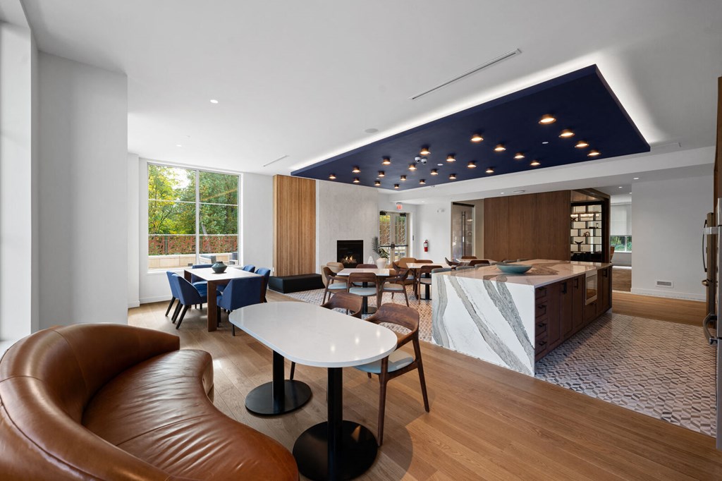 Entertainment kitchen with versatile seating options and abundant natural light at Hamilton at Eagleview, Exton, PA