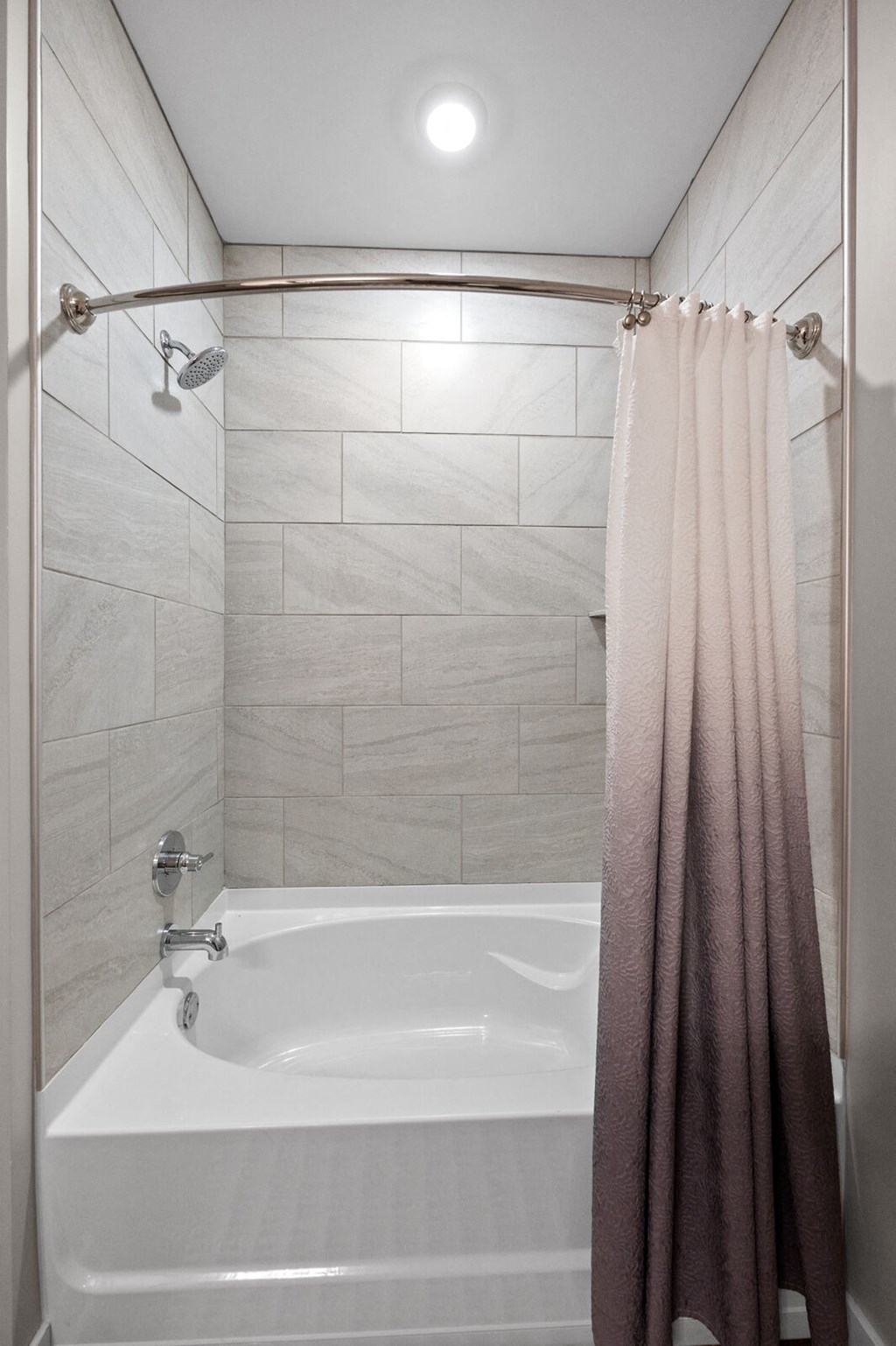 Bathroom featuring a combination shower and tub with a shower curtain at Hamilton at Eagleview, Exton, PA