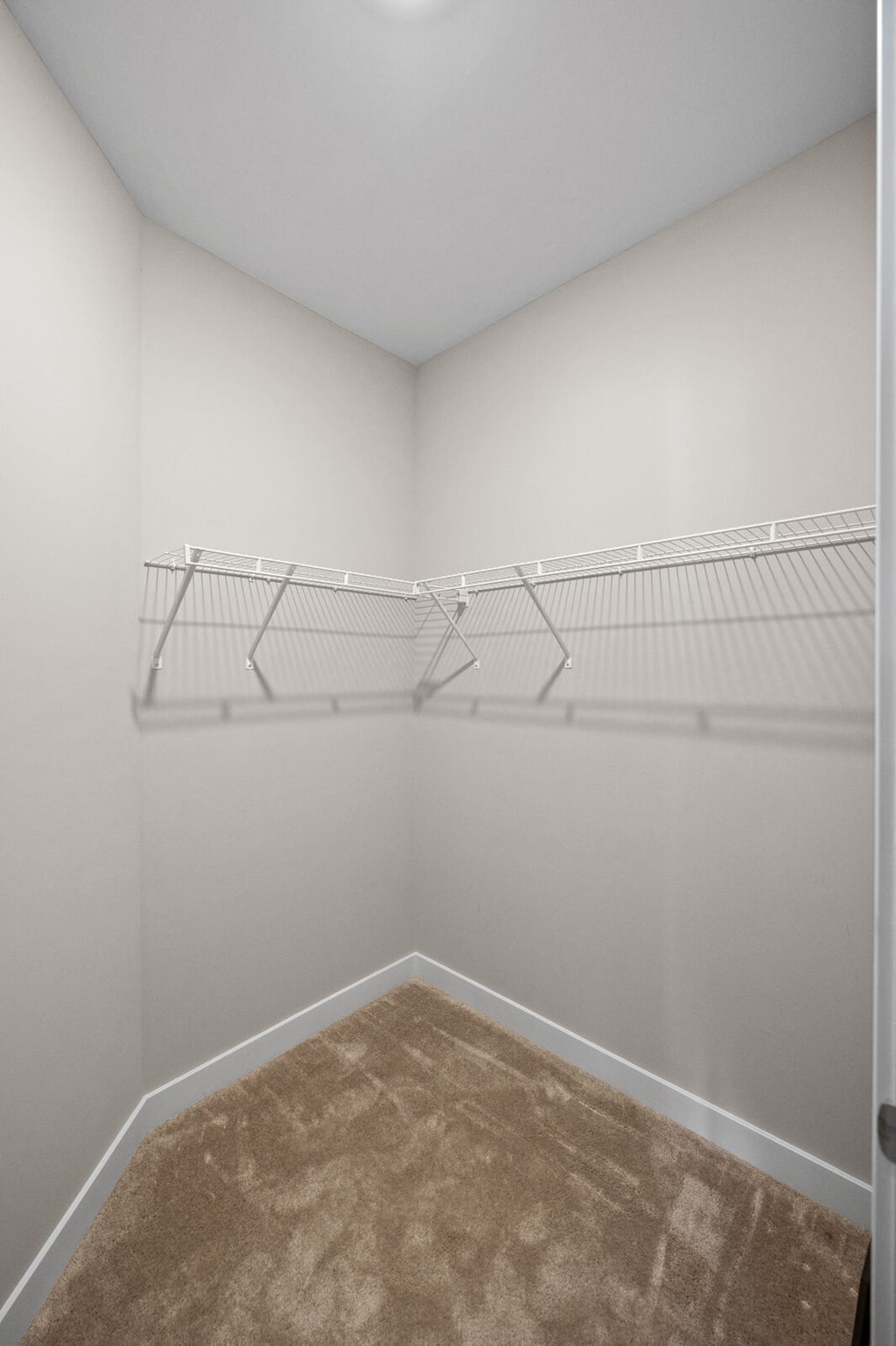 a spacious room with white walls and an empty closet at Hamilton at Eagleview, Exton Pennsylvania