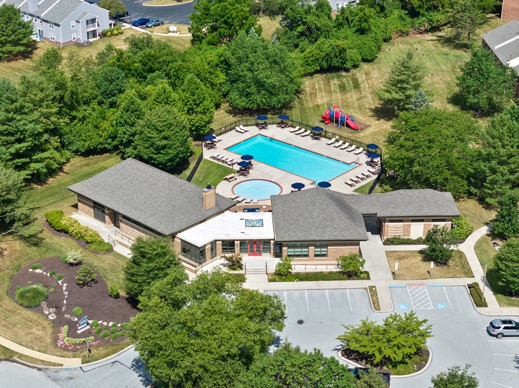 A large house with a pool in the backyard.
