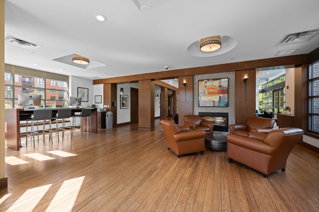 Clubhouse and business center with lounge area and computers.