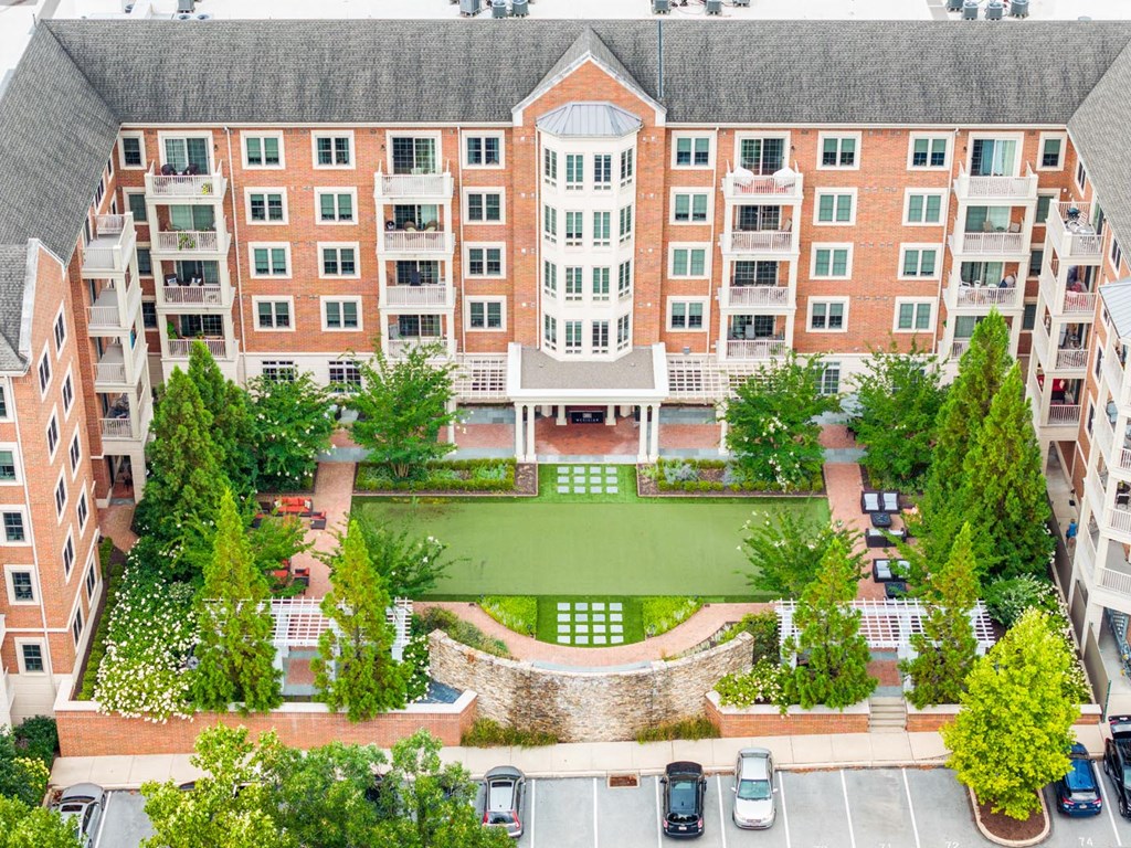 A large brick building with a courtyard in the middle.