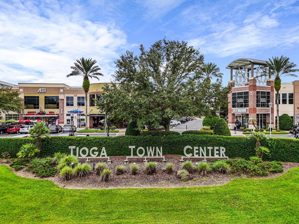 A sign in front of a building that says "Tioga Town Center".