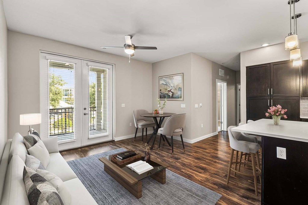 A living room with a white couch and a coffee table.