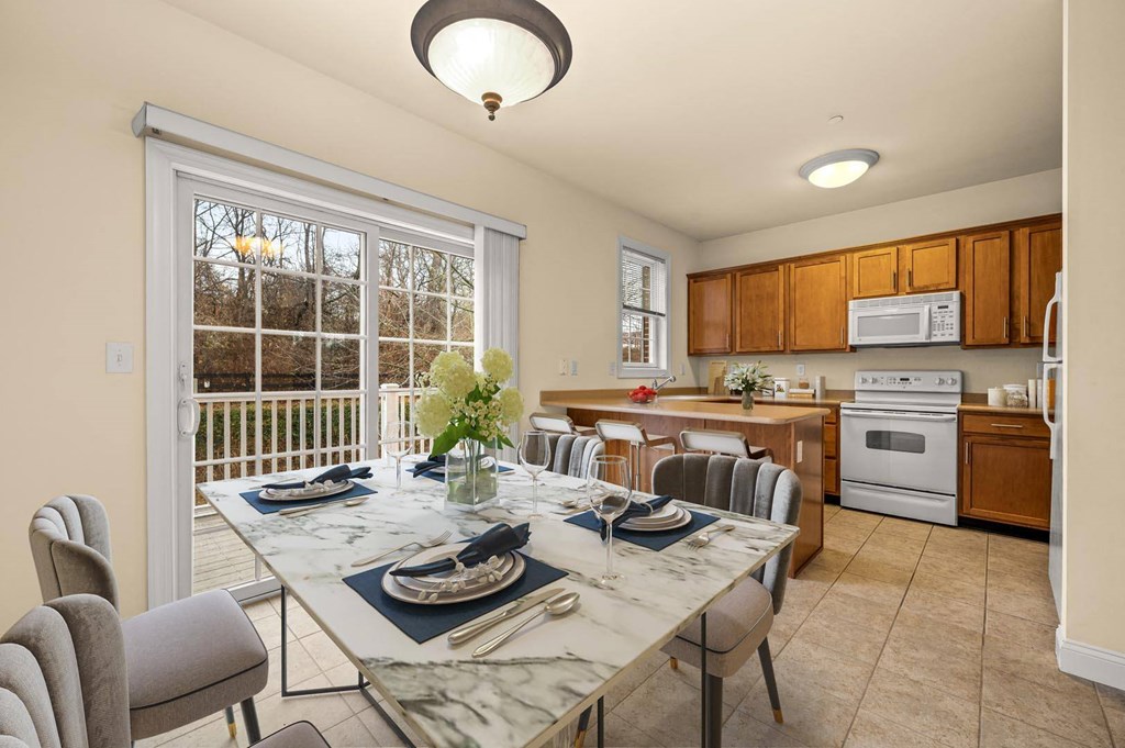 Elegant dining room with a table beautifully set for a meal at Claremont Apartments in Exton, PA.
