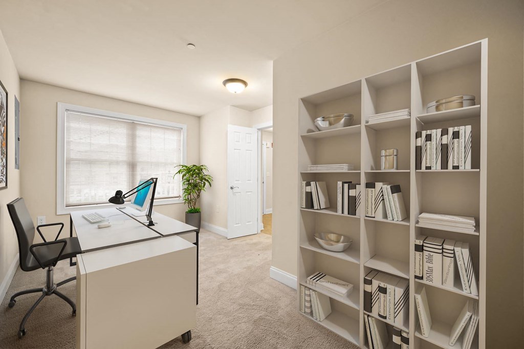 Functional room featuring a desk, chair, and bookshelf at Claremont Apartments in Exton, PA