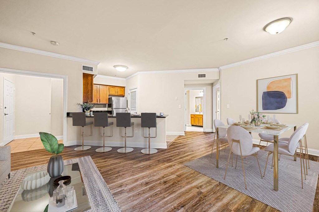 Contemporary kitchen with a dining table set up, creating a stylish and functional space at Claremont Apartments in Exton, PA