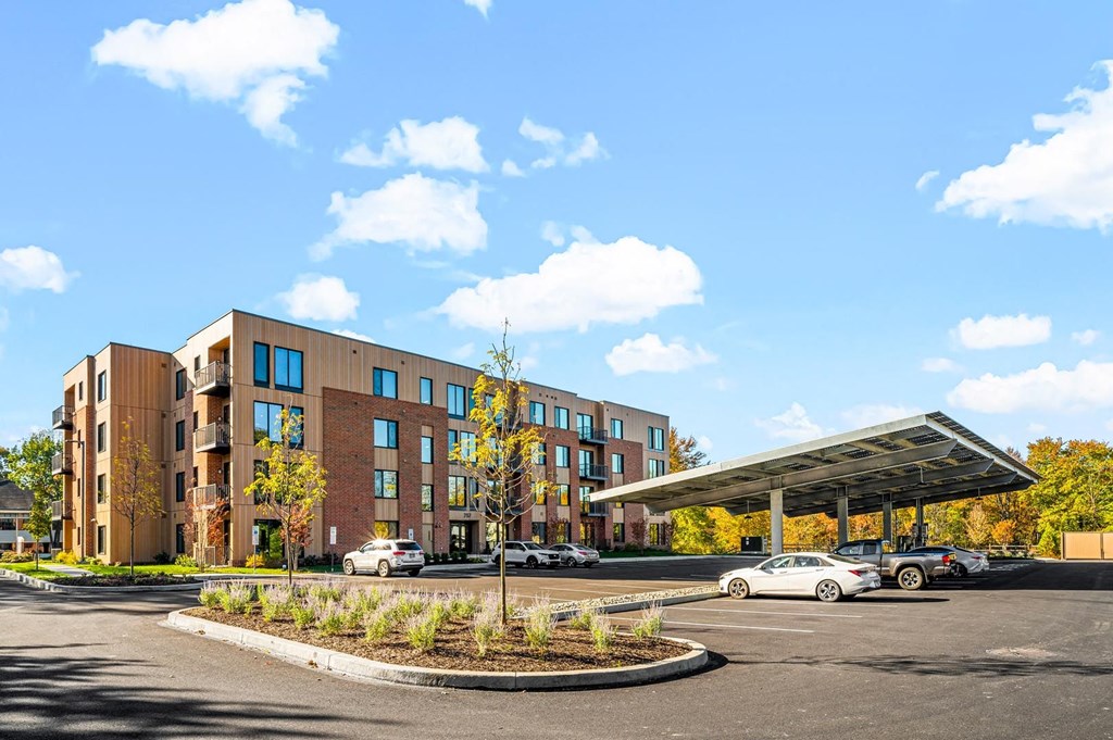 The building housing the hotel, featuring modern architecture and a welcoming exterior