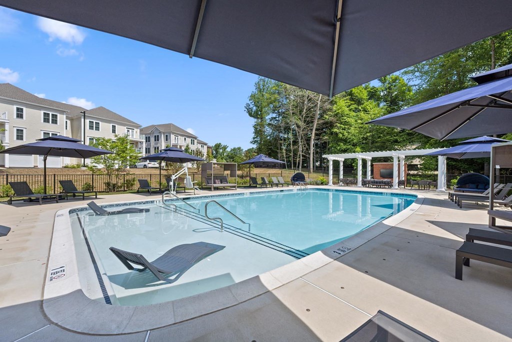 Hamilton at Eagleview offers a resort-style pool with comfortable seating and umbrellas for relaxation in Exton, PA