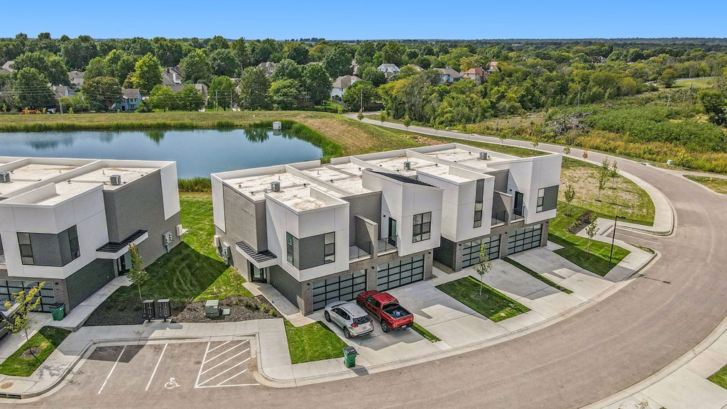 a rendering of a building with a lake in the background
