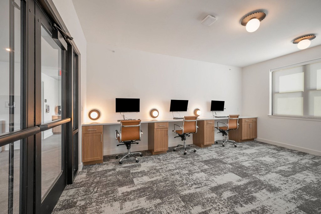 the preserve at ballantyne commons executive office space with two desks and two monitors  at Signature at West Pryor, Lee's Summit, MO, 64081