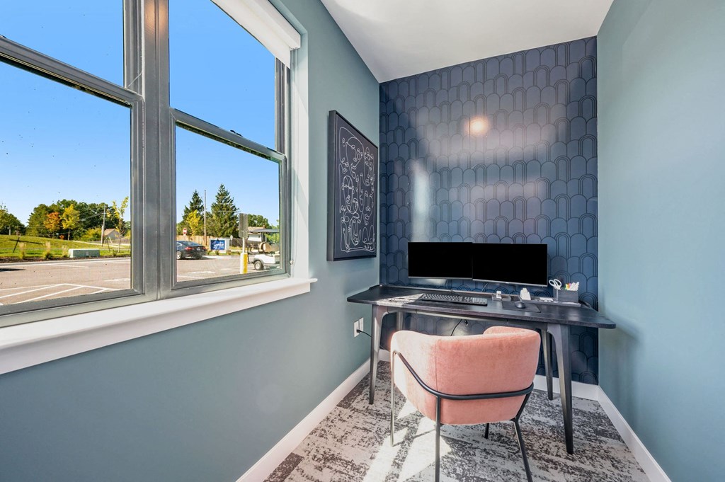 a home office with a desk and a window  at Signature at West Pryor, Missouri, 64081