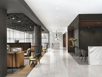 Lobby with marble flooring, conversational seating and dark finishes