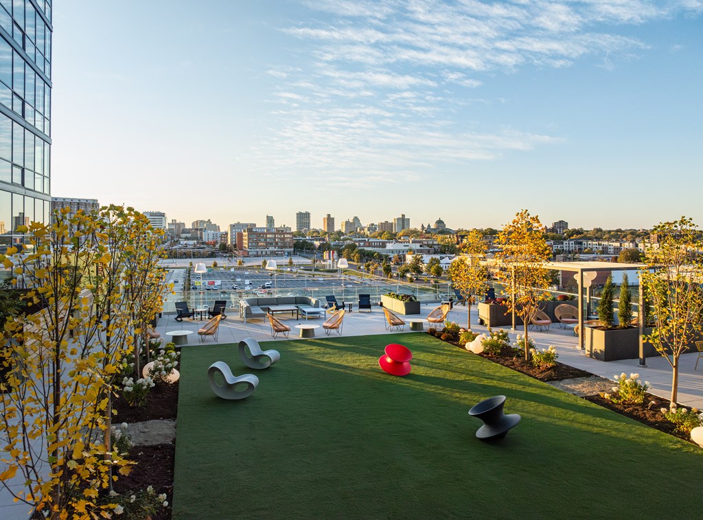 A green space with a view of the city skyline. at One Foundry Way Apartments, St Louis, Missouri