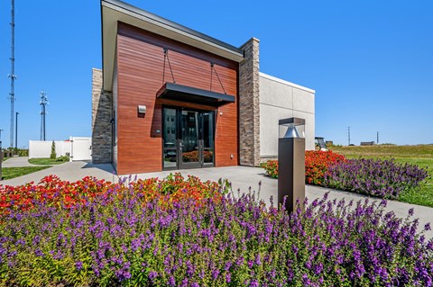 a building with purple flowers in front of it