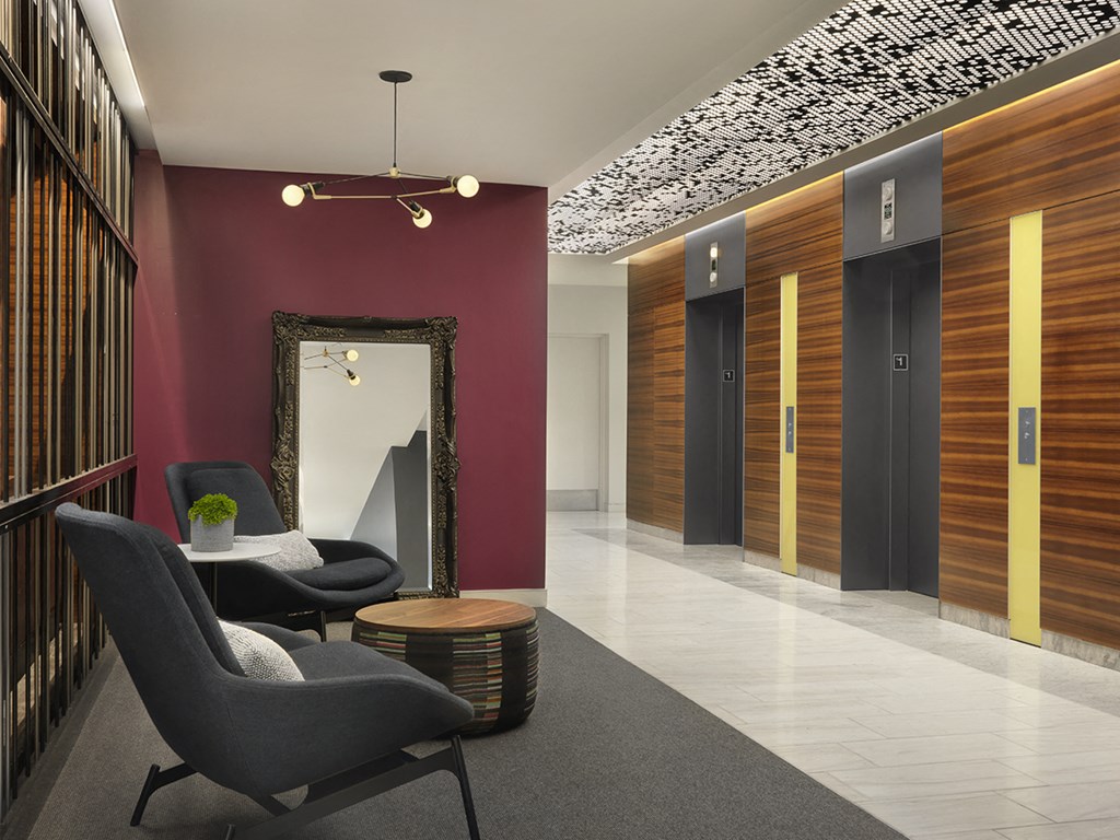 Lobby elevators with seating area  at Clayton On The Park, Clayton, Missouri