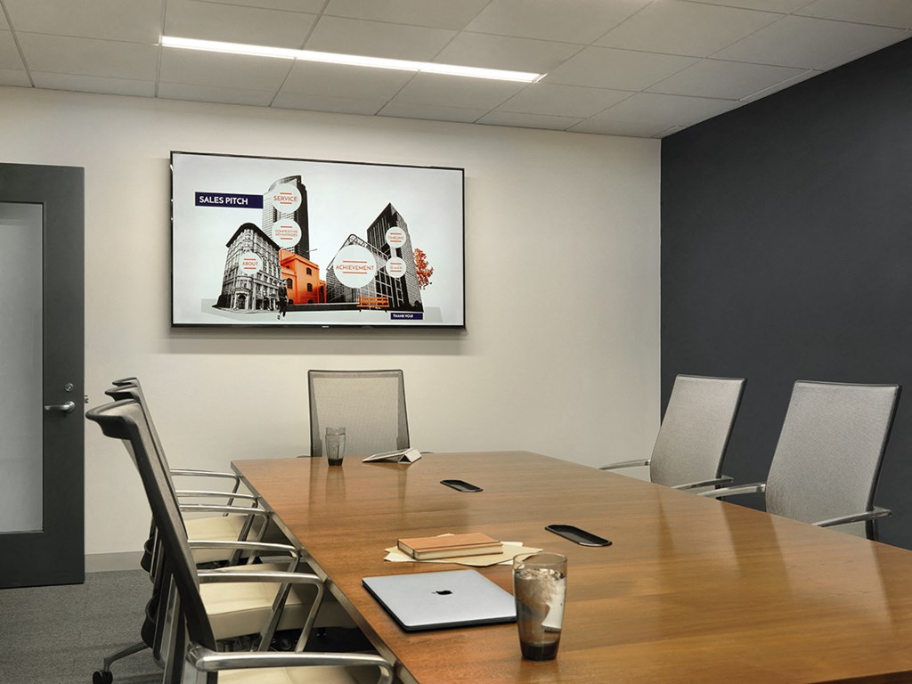 Conference room with large table, chairs and television  at Clayton On The Park, Clayton, MO
