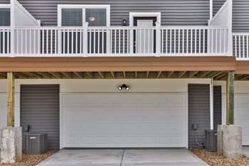 Exterior 2 Car Garage with Driveway and Balcony Directly Above - Photo Gallery 3