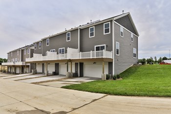 Rear Exterior View Showing 2 car Garage & Main Floor Balcony - Photo Gallery 2