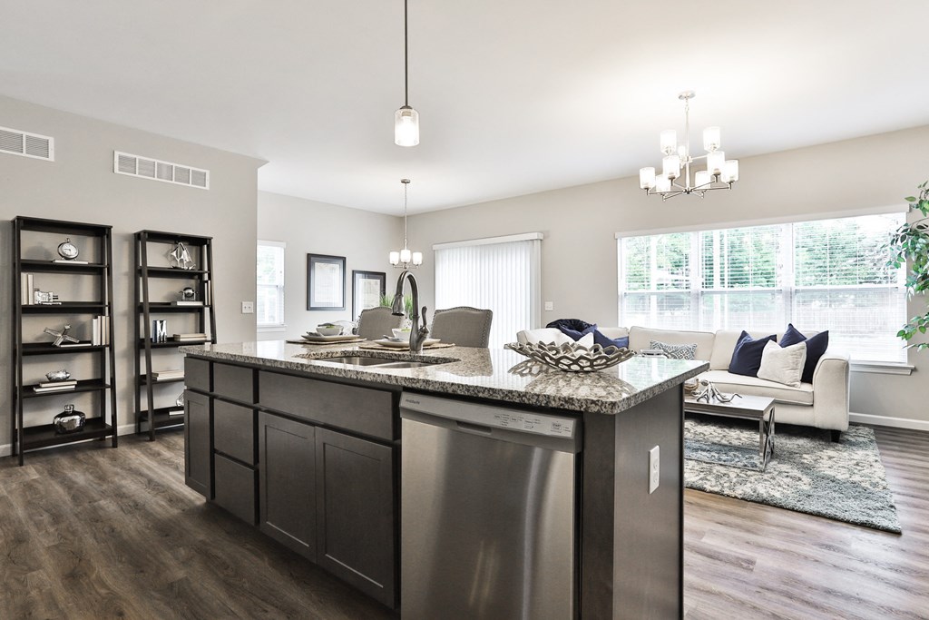 an open floor plan with a kitchen and living room
