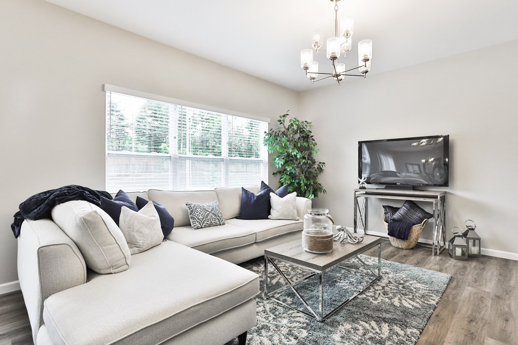 a living room with a couch and a television at The Willows, Missouri