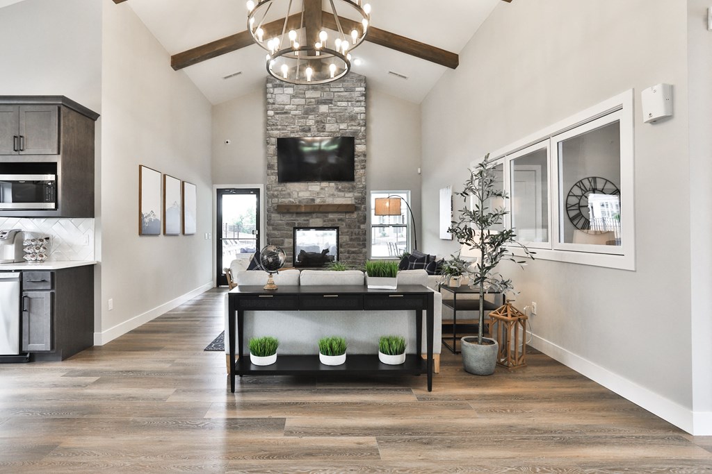 a living room with a fireplace and a table