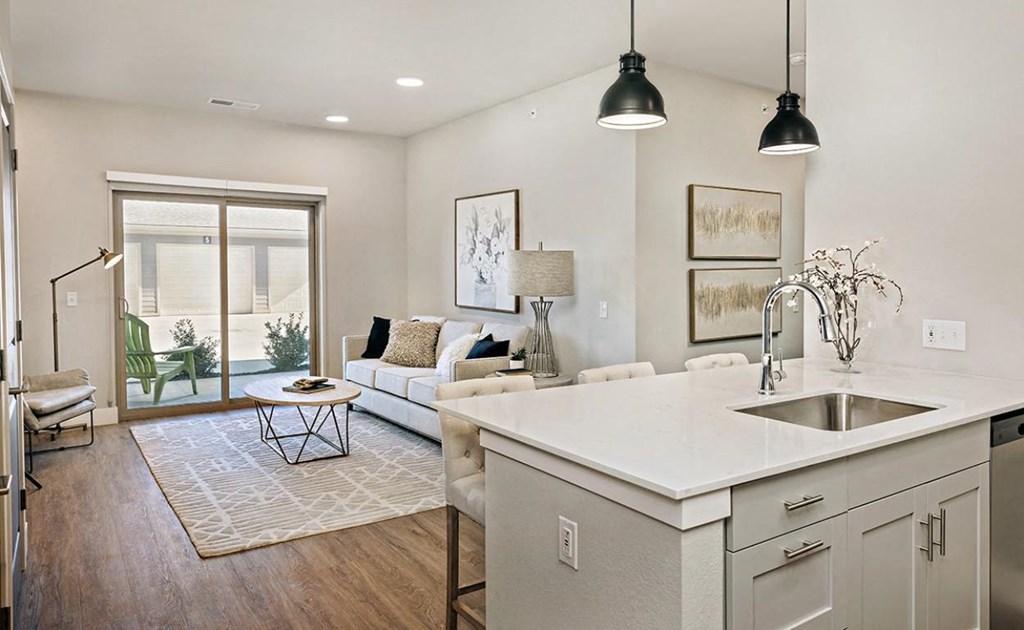 an open floor plan with a kitchen and living room at The Prairie Luxury Apartments, Dardenne Prairie, MO 63368