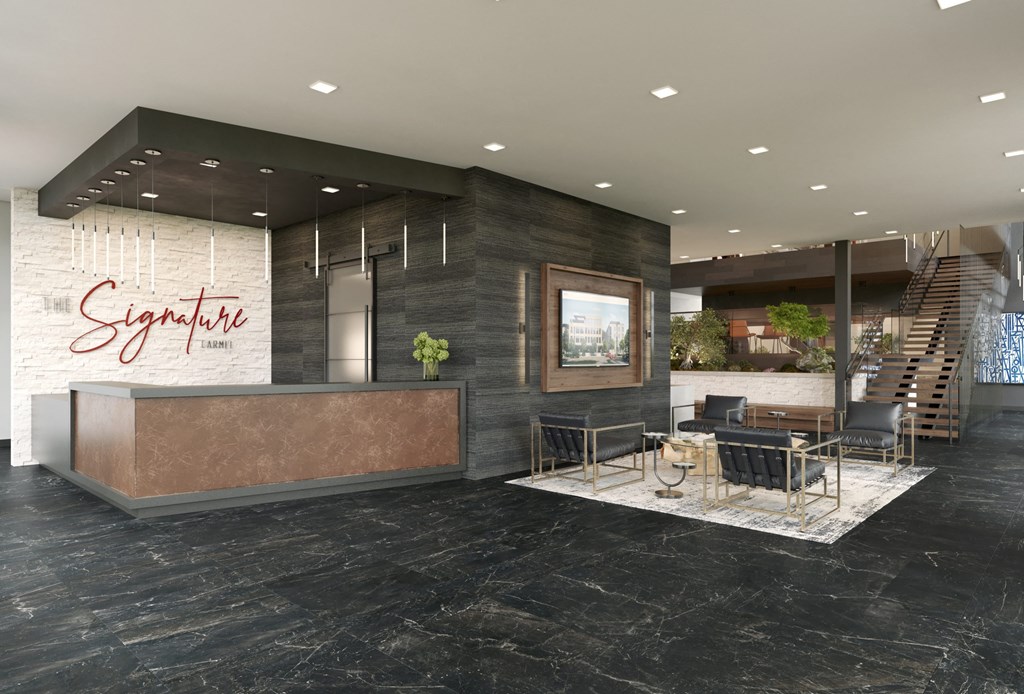 a lobby with a seating area and a reception desk