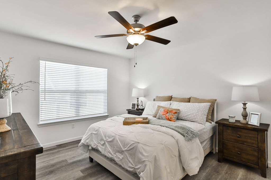 a bedroom with a bed and a ceiling fan at The Prairie Villas, Missouri, 63368