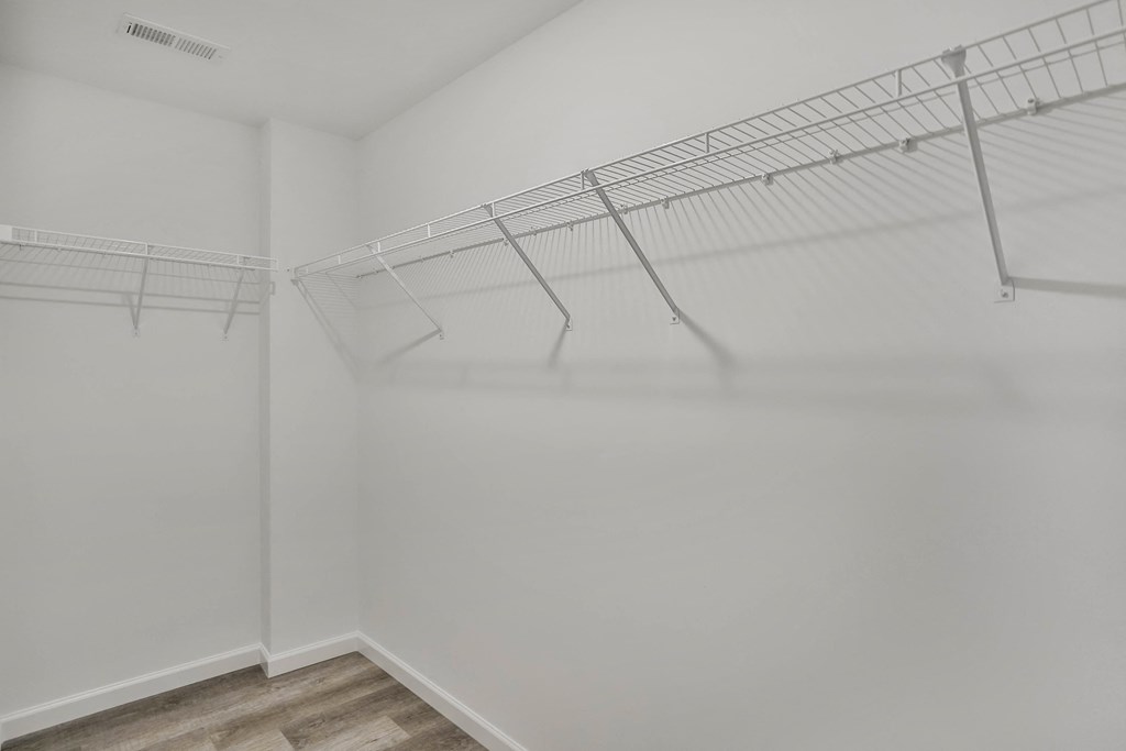the spacious closet in the living room of a manufactured home with white walls and a at The Prairie Villas, Dardenne Prairie