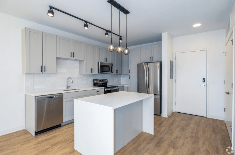 a kitchen with white cabinets and stainless steel appliances  at 2200 LaSalle, St Louis