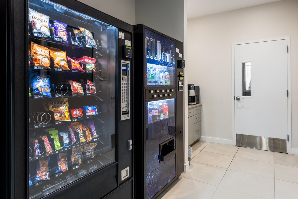 a vending machine in the lobby of a building with a door at 2200 LaSalle Apartments, St Louis, MO
