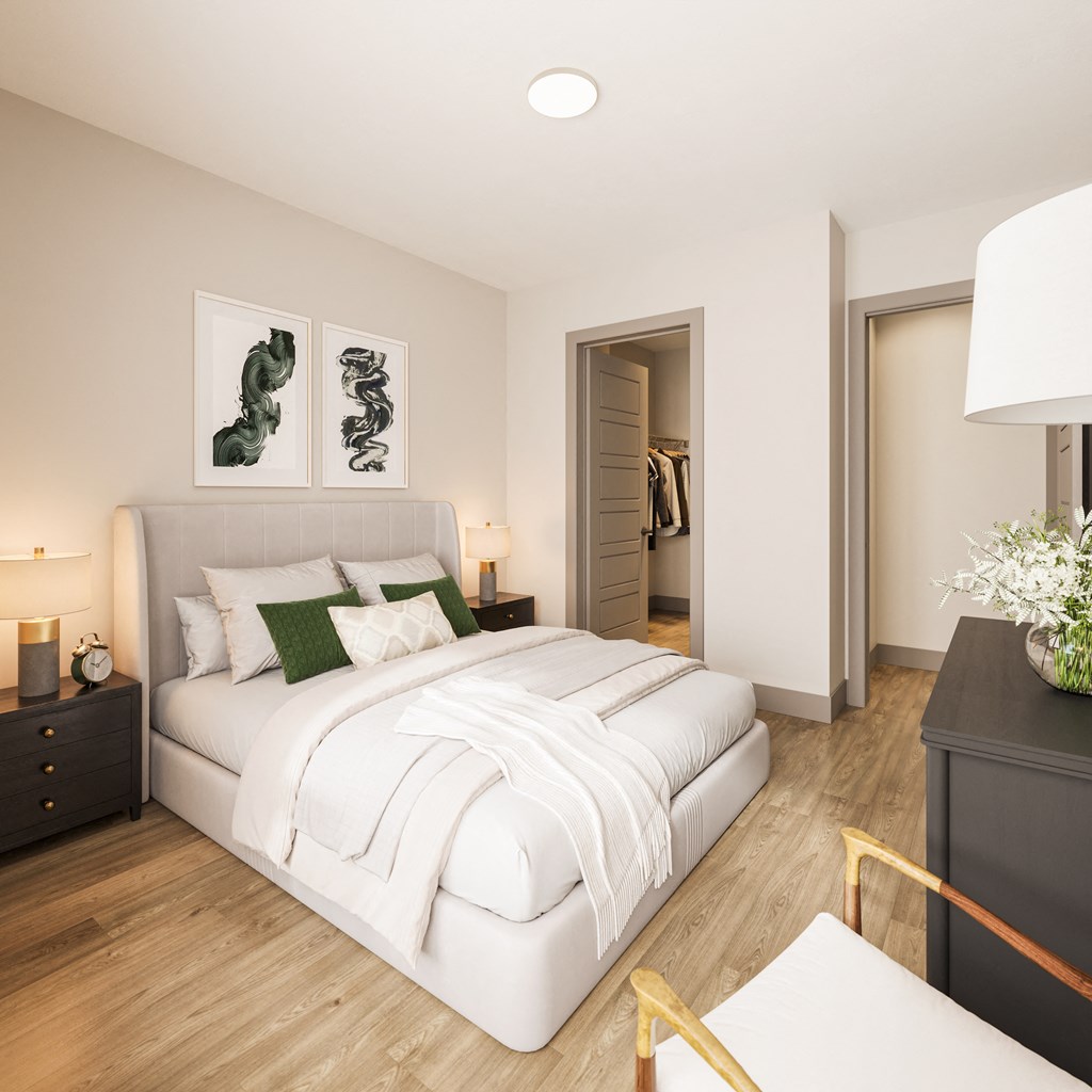 a bedroom with a large white bed and a white couch at Bemiston Place Apartments, Clayton, 63105