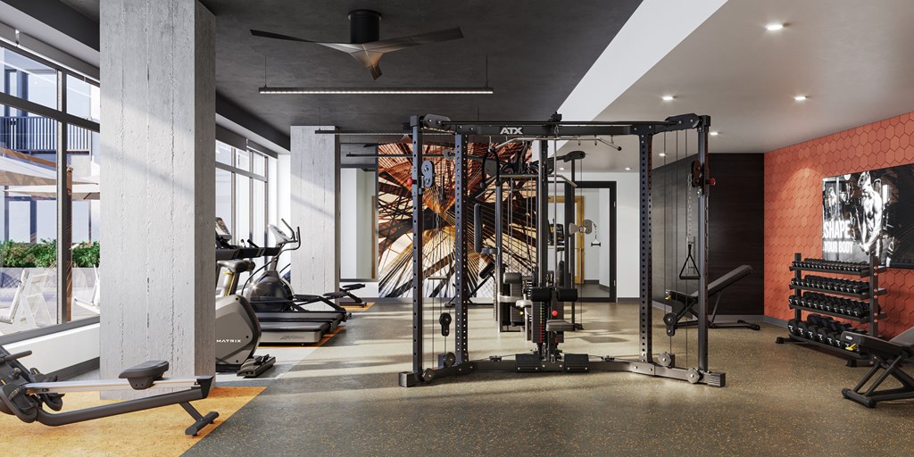a gym with exercise equipment and a large window at Bemiston Place Apartments, Missouri