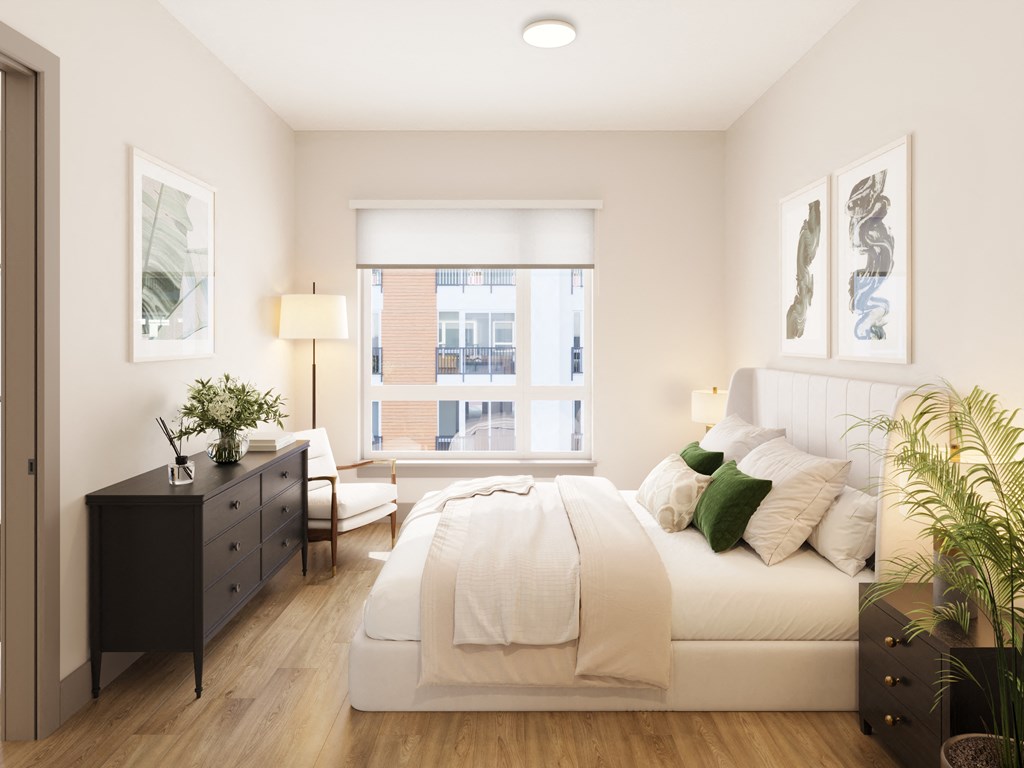 a white bedroom with a large bed and a window at Bemiston Place Apartments, Clayton, MO 63105