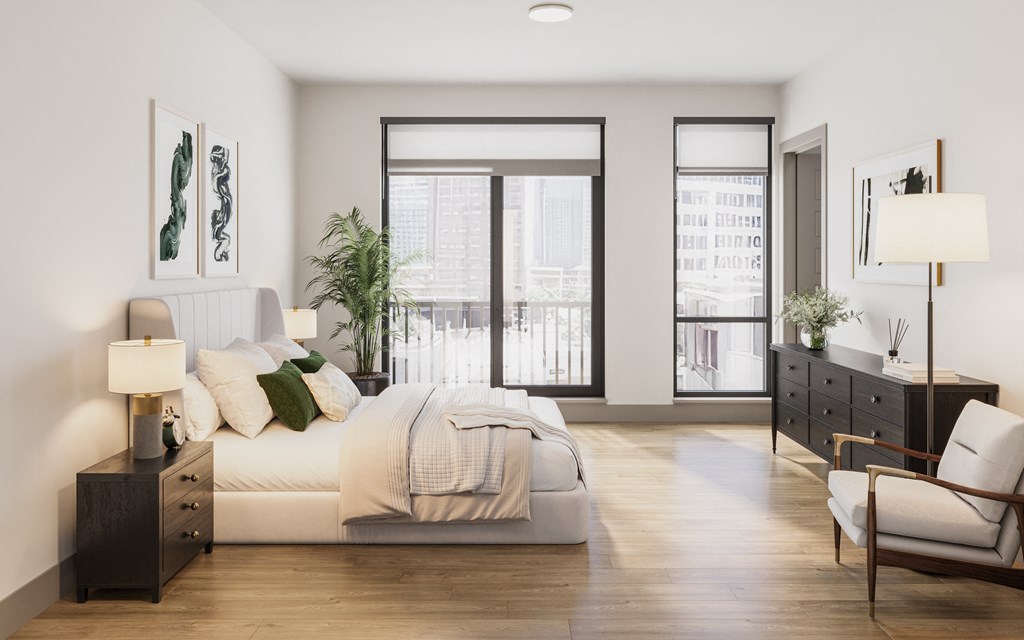 a bedroom with a white bed and a large window at Bemiston Place Apartments, Clayton Missouri