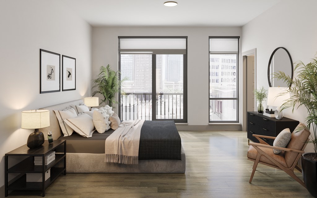 a bedroom with a large bed and a balcony at Bemiston Place Apartments, Missouri