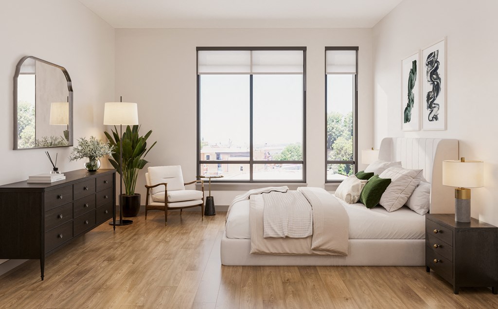 a bedroom with a bed and a dresser and a window at Bemiston Place Apartments, Clayton, MO