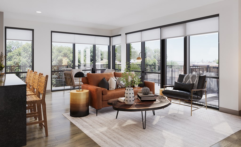 a living room with a brown couch and a table at Bemiston Place Apartments, Clayton 