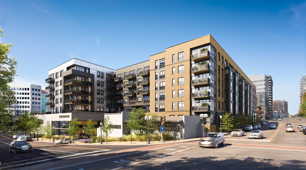 a rendering of a large apartment building on a city street at Bemiston Place Apartments, Clayton, MO 63105