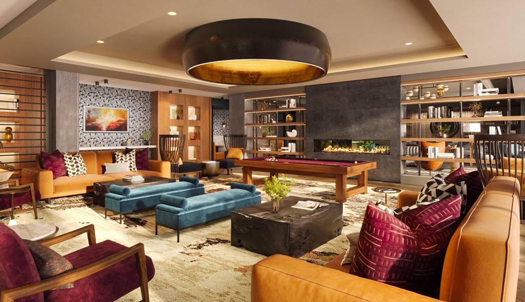 a living room filled with furniture and a pool table at Bemiston Place Apartments, Clayton Missouri